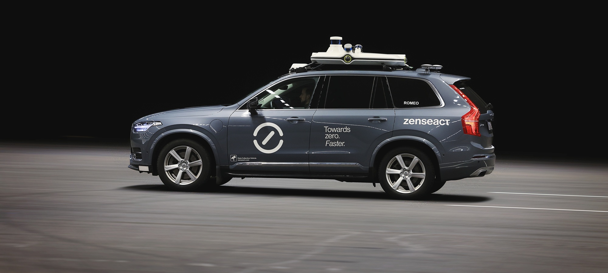 Zenseact car with sensors on top, dark background